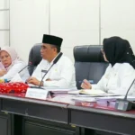 EQOZ MEDIA Gubernur Sulteng Anwar Hafid tengah dan Wakil Gubernur Sulteng Reny Lamadjido kiri eqozmedia.id